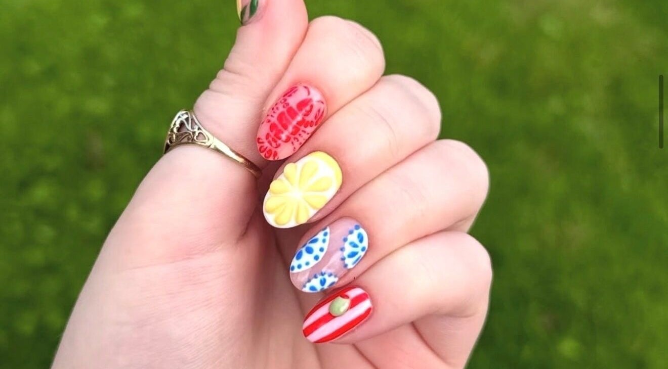 Colorful nail designs at Beauty by Jodie in Cockermouth, England, GB, featuring intricate patterns.