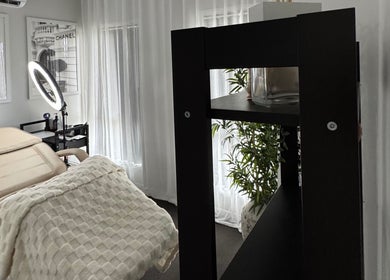 Calm treatment room at Bek Moran Artistry, Burpengary East, Queensland, AU, featuring stylish decor and cozy seating.