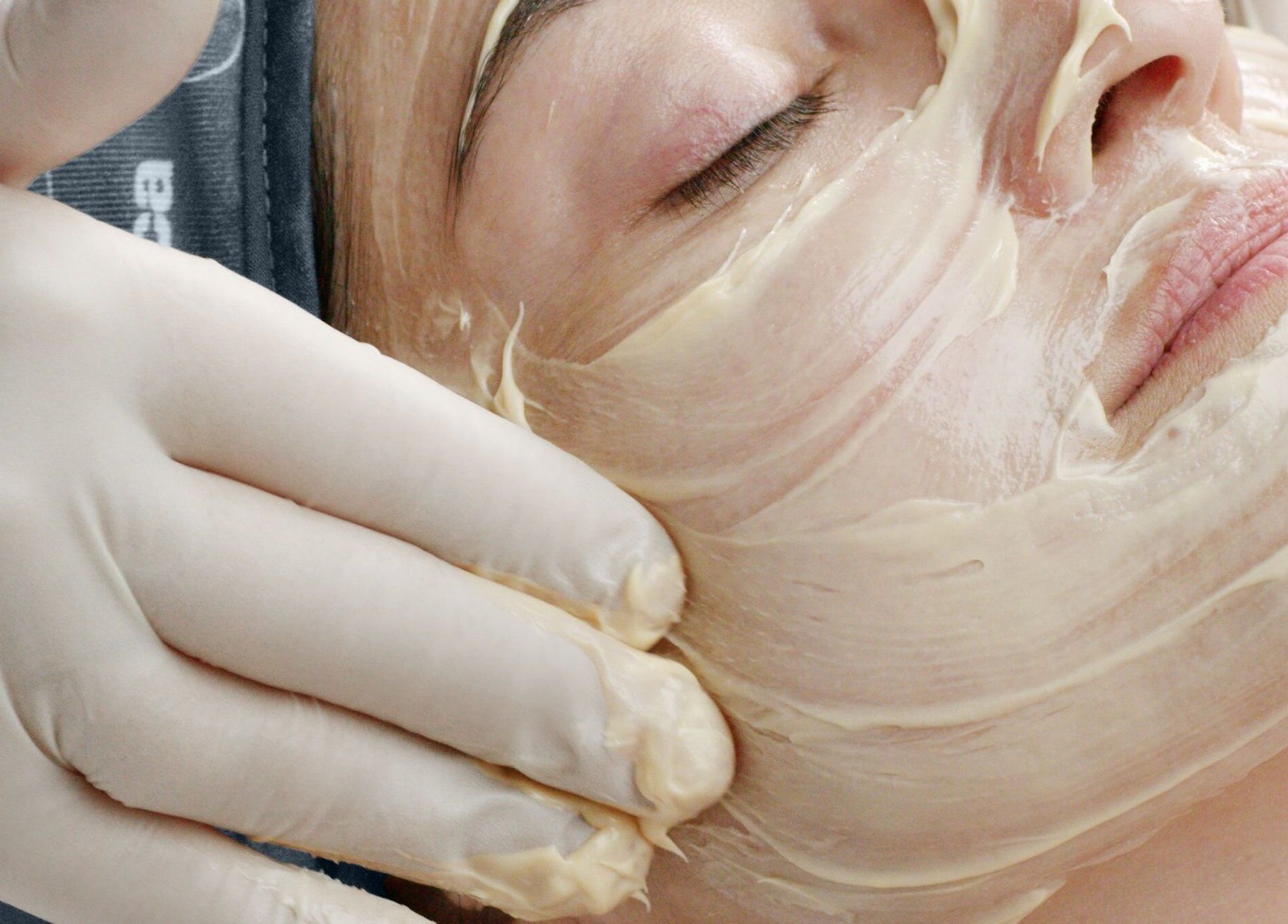 A soothing facial treatment at Perfect Touch, Wallingford, England, GB, featuring a cream application.