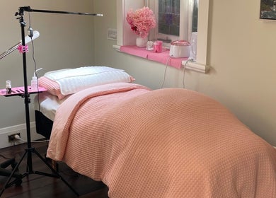Relaxing treatment room at Lara Beauty Collective in Randwick, New South Wales, AU with pink decor.