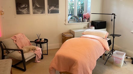 Cozy spa room at Lara Beauty Collective, Randwick, New South Wales, AU with soft lighting and plush decor.