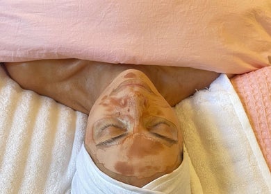 Woman receiving facial treatment at Lara Beauty Collective, Randwick, New South Wales, AU.