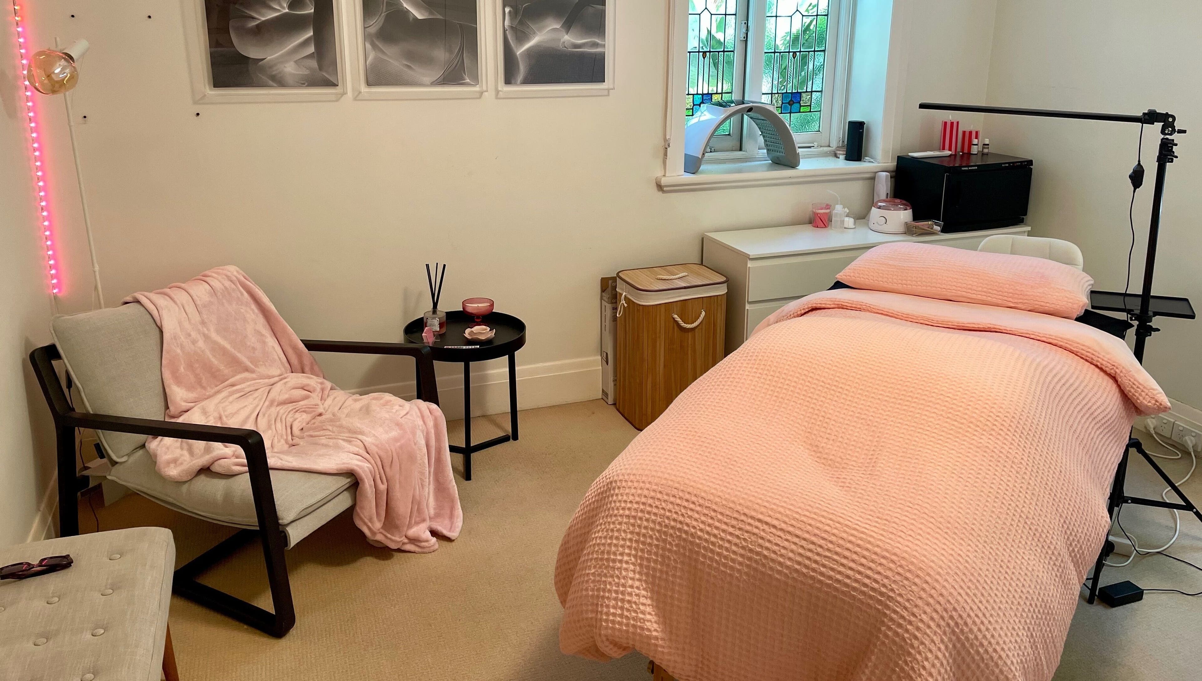 Relaxing treatment room at Lara Beauty Collective in Randwick, New South Wales, AU with plush pink décor.