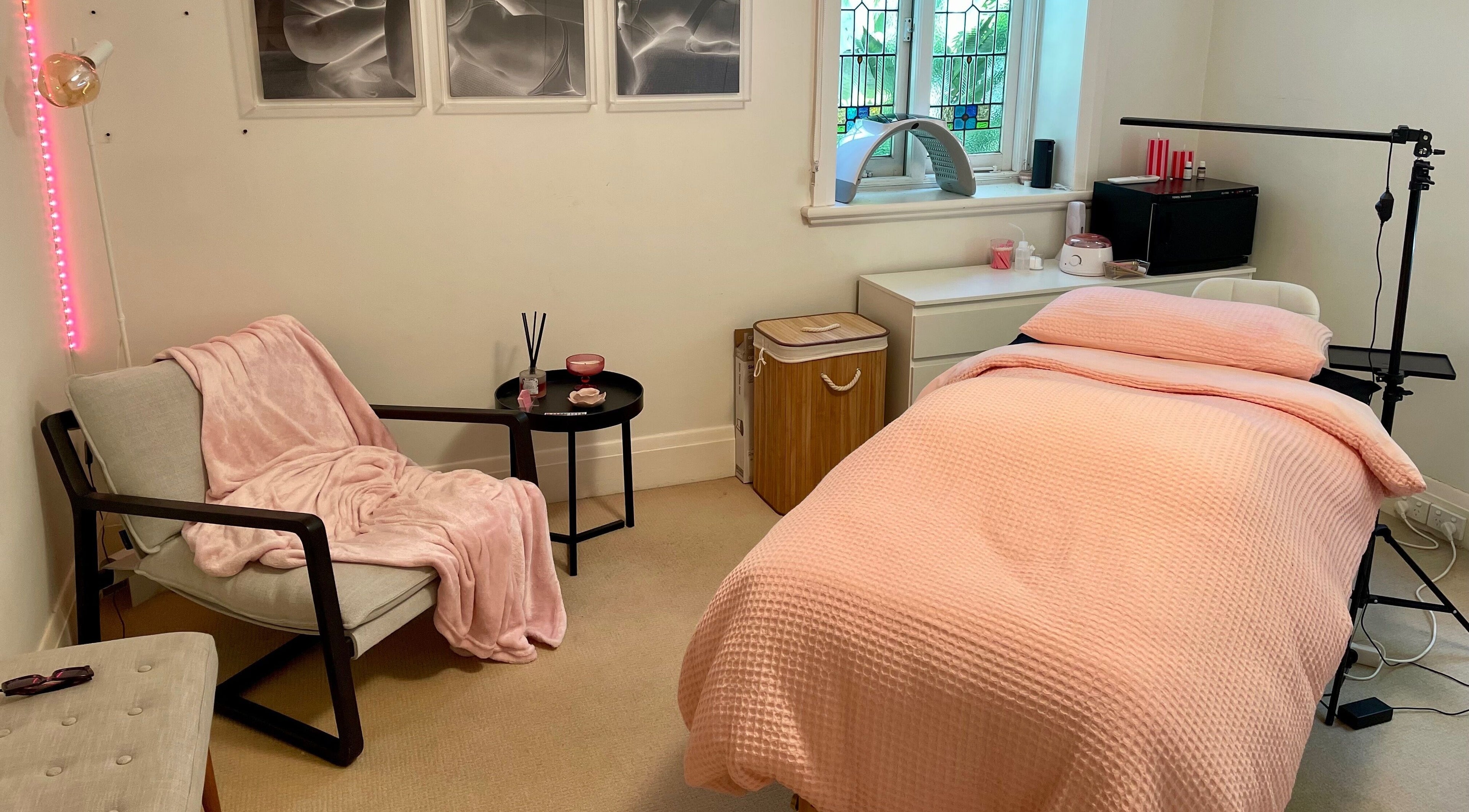 Relaxing treatment room at Lara Beauty Collective in Randwick, New South Wales, AU with plush pink décor.