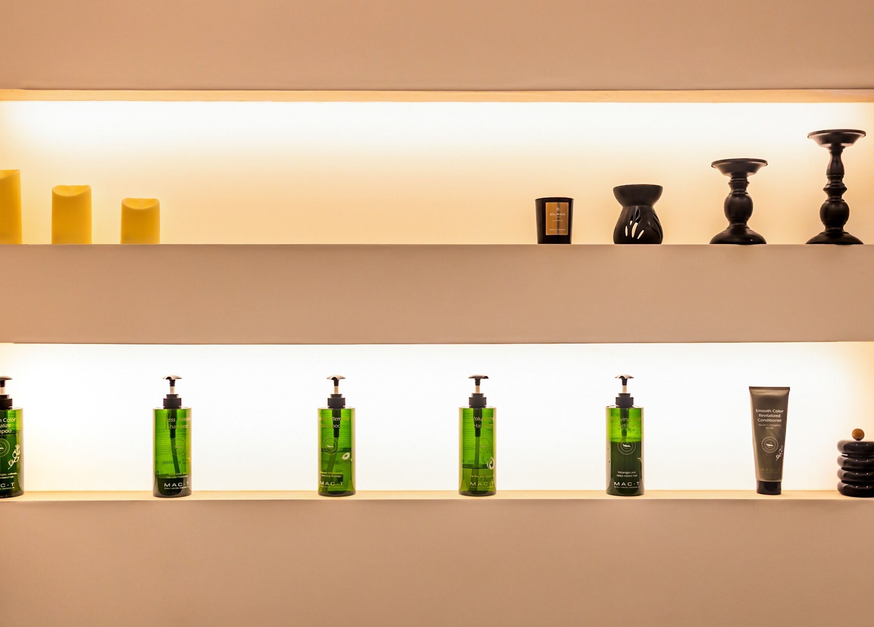 Illuminated shelves with beauty products at MOOD SkinLab 美肌研所, Melbourne, Victoria, AU.