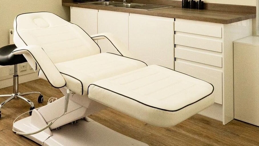 Luxurious treatment room at Natalie ProBeauty, Great Shelford, England, GB with modern white massage chair.