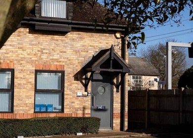 Charming exterior of Natalie ProBeauty in Great Shelford, England, GB, with brick detail and modern design.