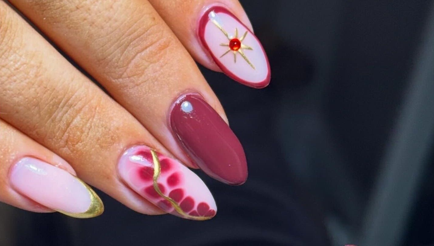 Stunning nail art with gold accents at Beauty Bliss By Becca, Annan, Scotland, GB.