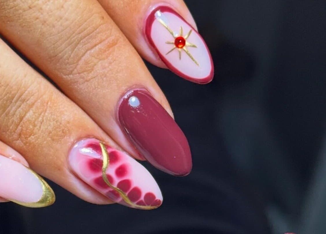 Stunning nail art with gold accents at Beauty Bliss By Becca, Annan, Scotland, GB.