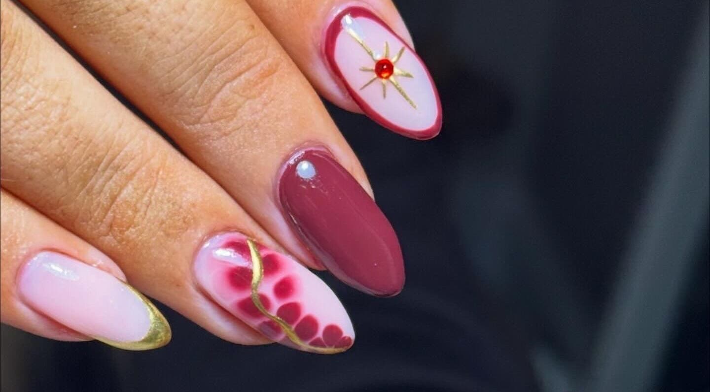 Stunning nail art with gold accents at Beauty Bliss By Becca, Annan, Scotland, GB.