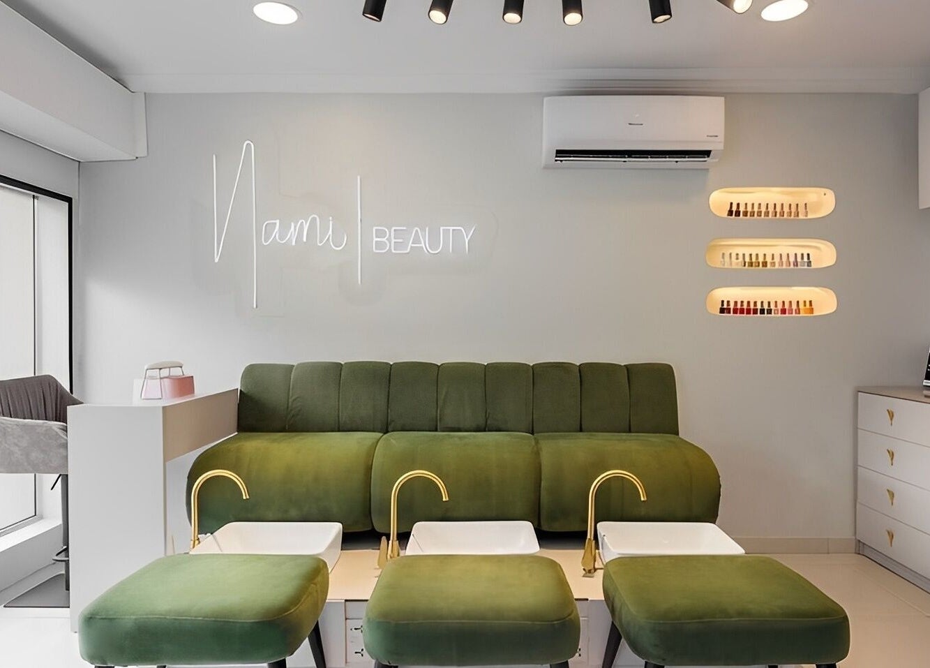 Modern interior of Nami Lagos, Lagos, NG with stylish green seating and a cozy ambiance.