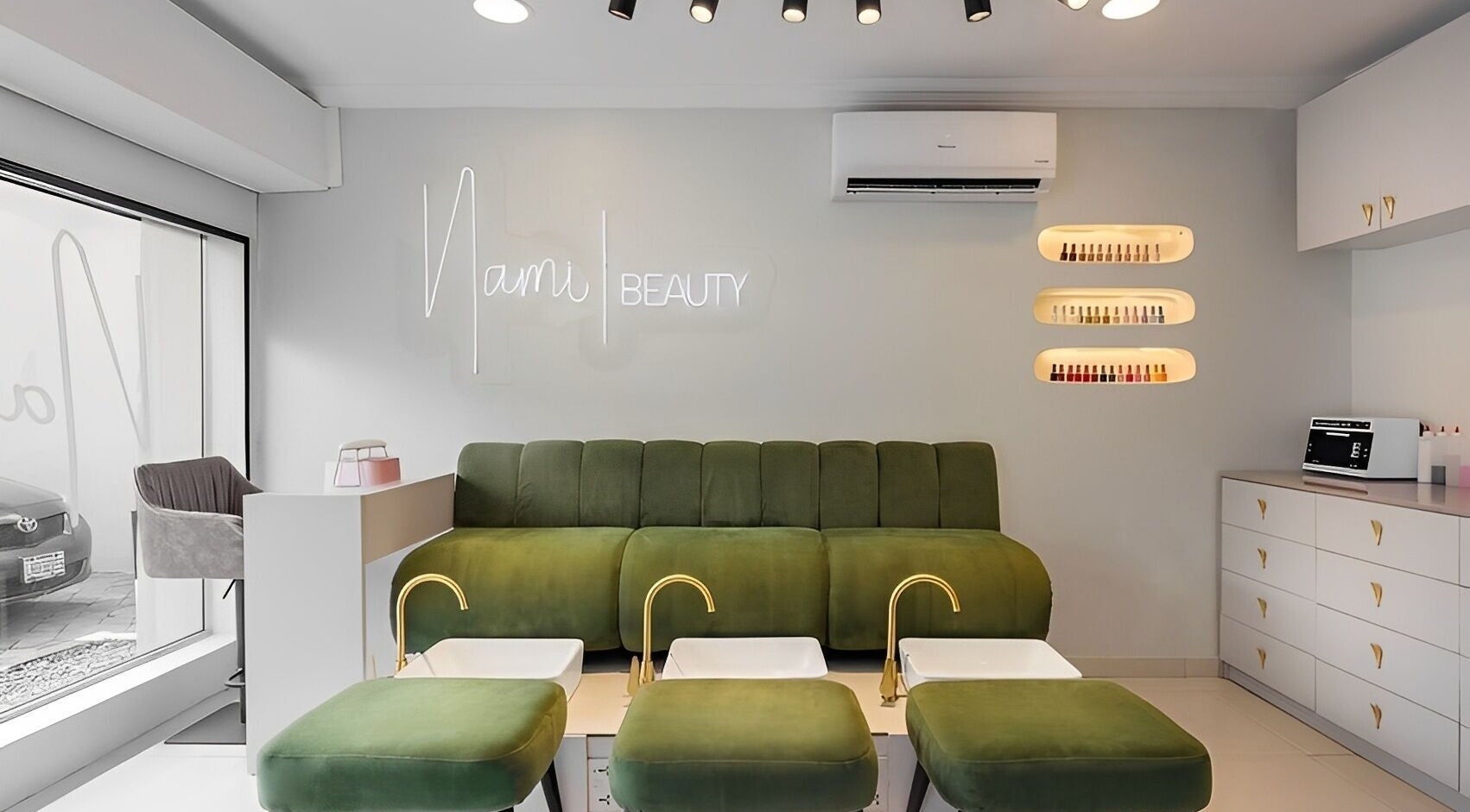 Modern interior of Nami Lagos, Lagos, NG with stylish green seating and a cozy ambiance.