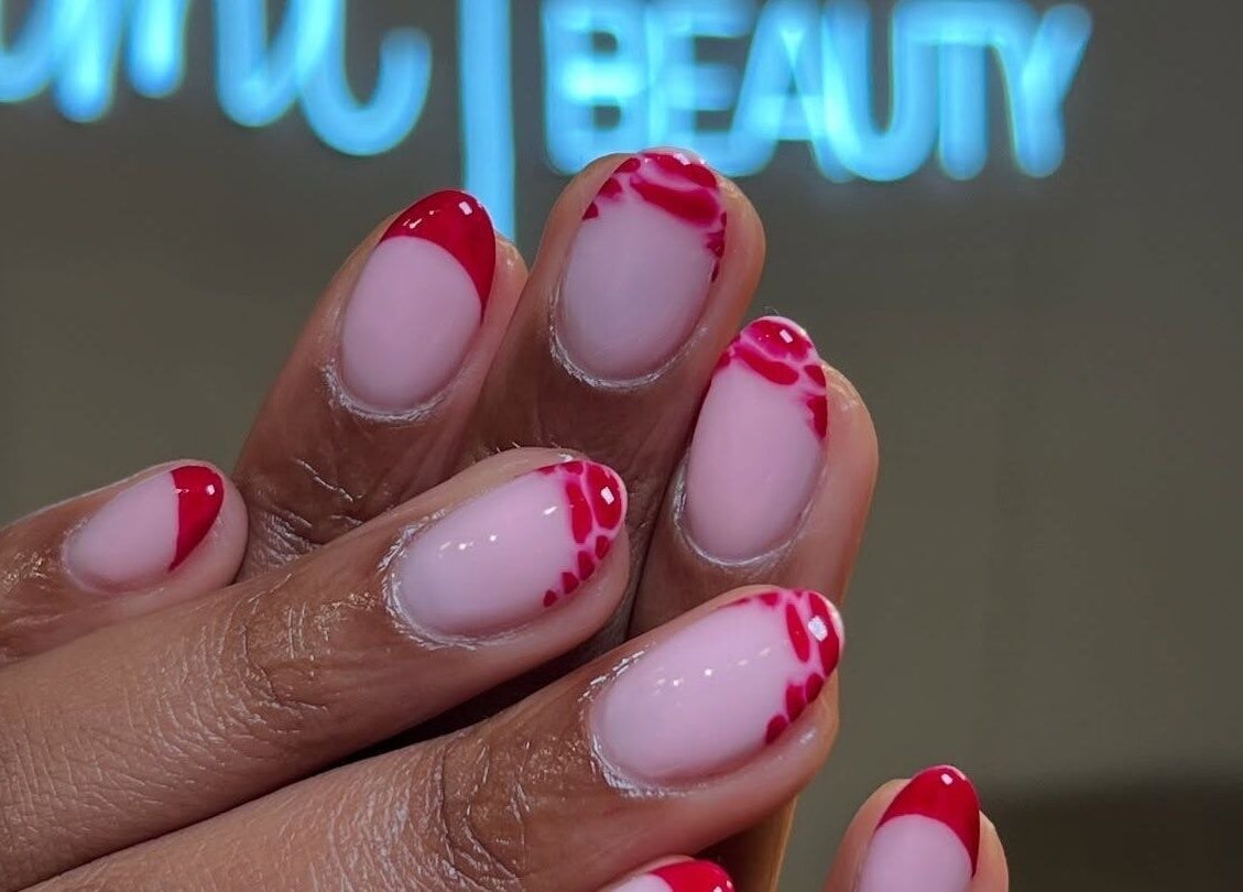 Elegant red and pink nail art at Nami Lagos, Lagos, Lagos, NG. Perfect for a stylish and modern look.