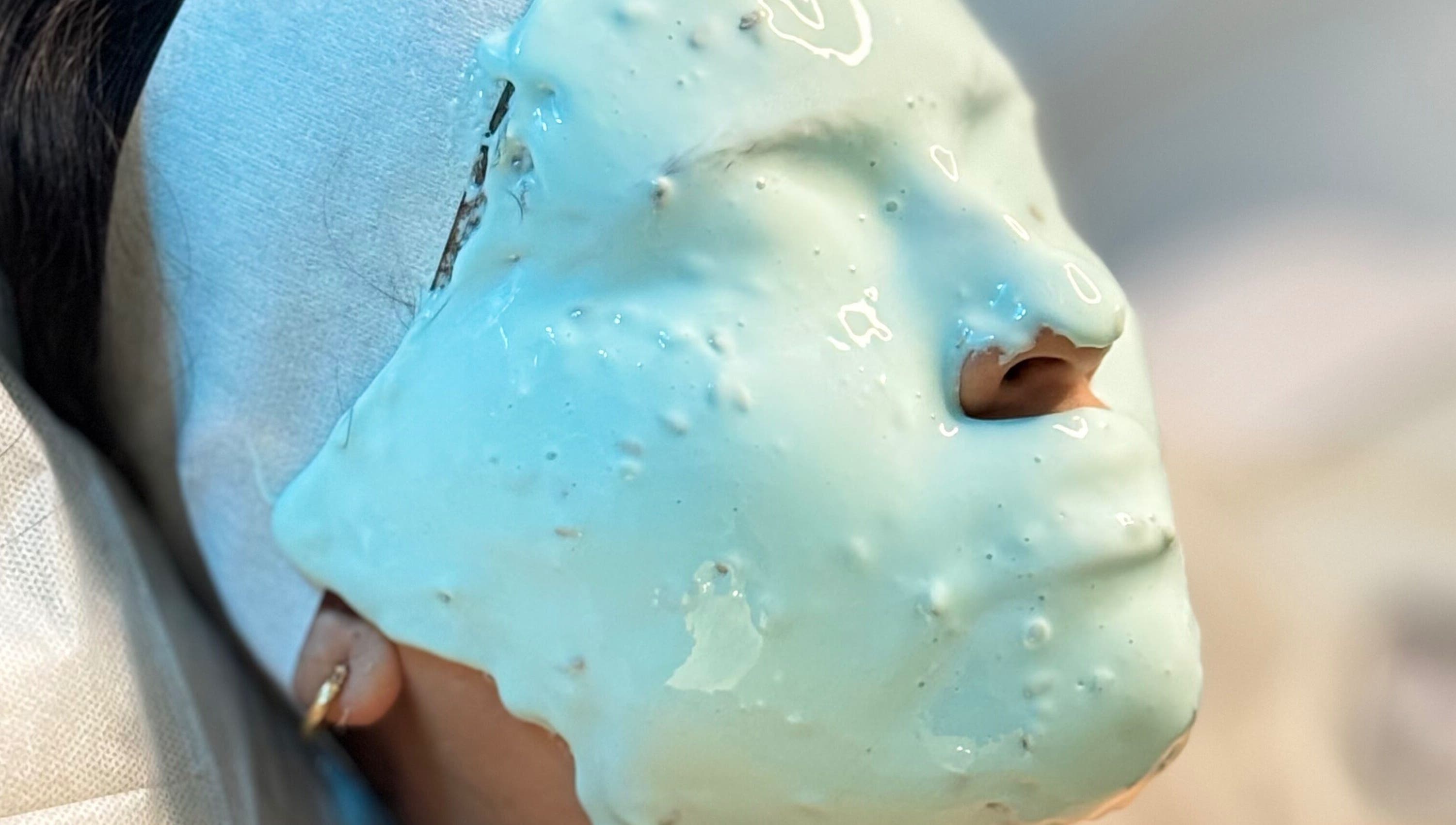 Relaxing facial mask treatment at Bellas Glow Beauty in London, England, GB. Experience ultimate skincare.