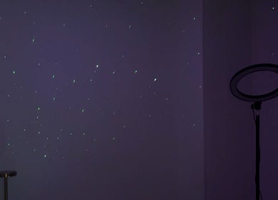 Serene starry night ambiance at Bellas Glow Beauty in London, England, GB, featuring a ring light setup.
