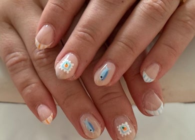 Intricate nail art at Wild Roots Studio, Easley, South Carolina, US, showcasing creative designs and precise detail.
