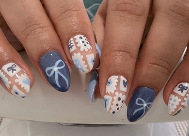 Elegant nail art in blue and white at Wild Roots Studio, Easley, South Carolina, US.