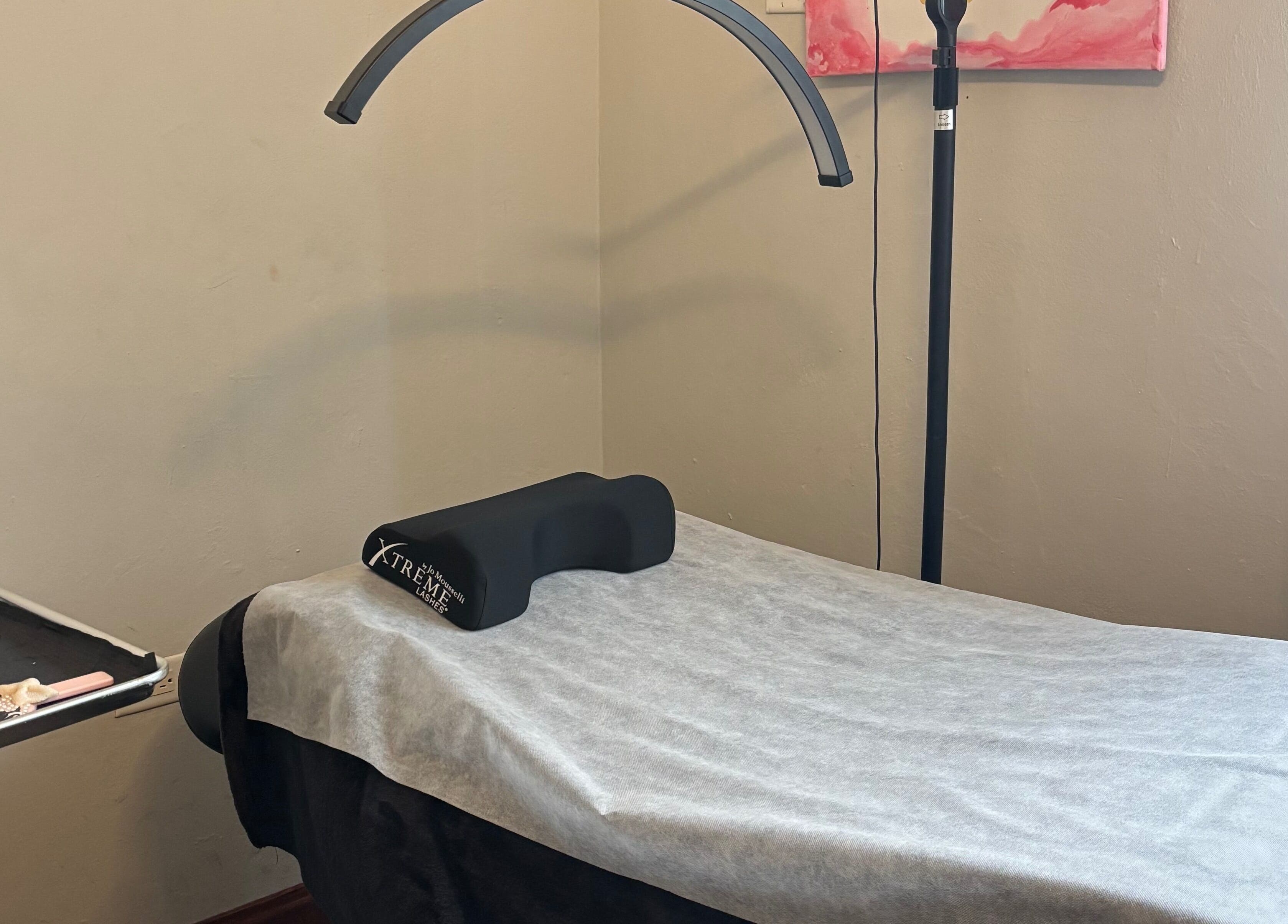 Eyelash extension setup at AP Beauty, Kingston, St. Andrew Parish, JM, showcasing a comfortable treatment bed.