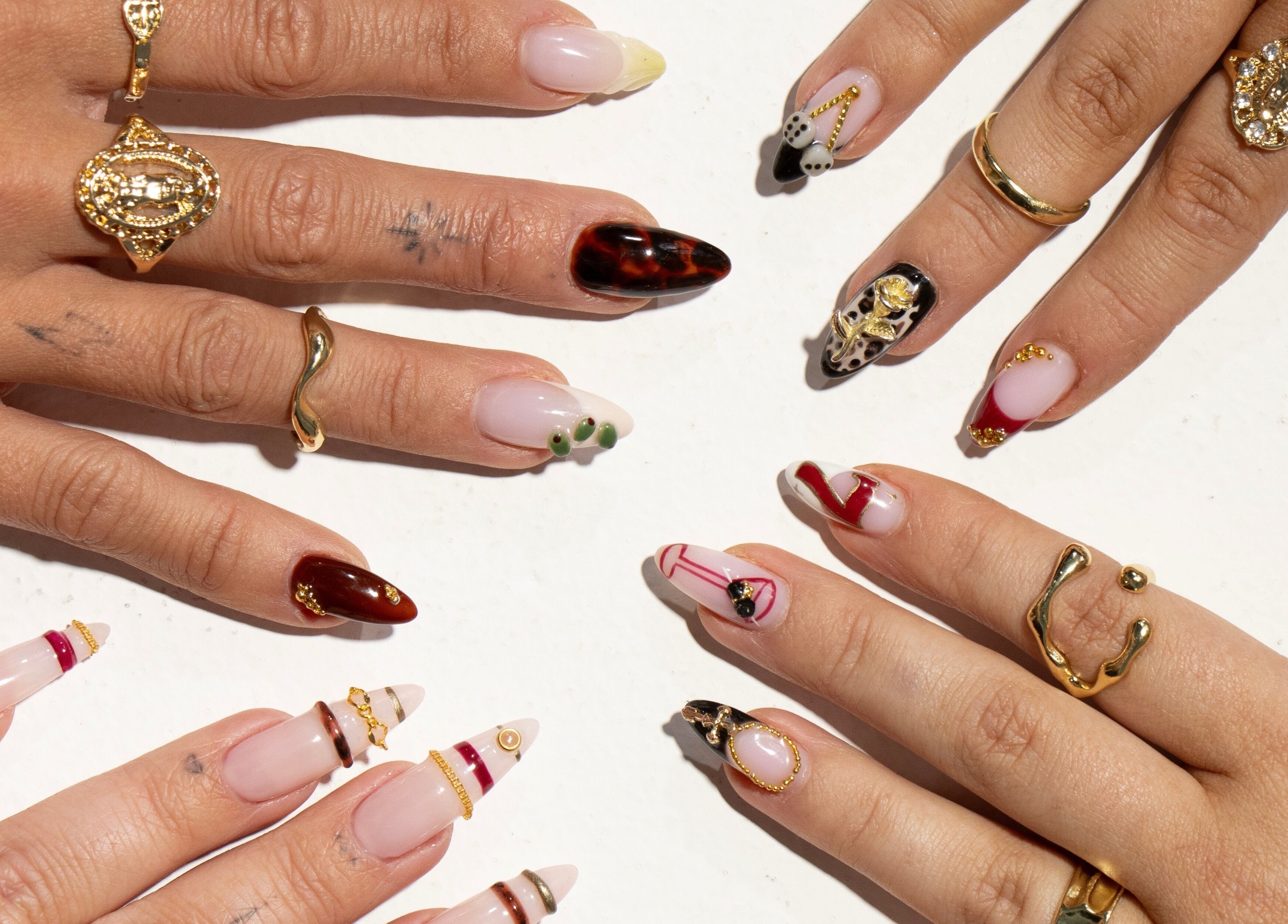 Gel By Jayde showcases artistic nail designs in Melbourne, Victoria, AU with elegant rings and rich colors.