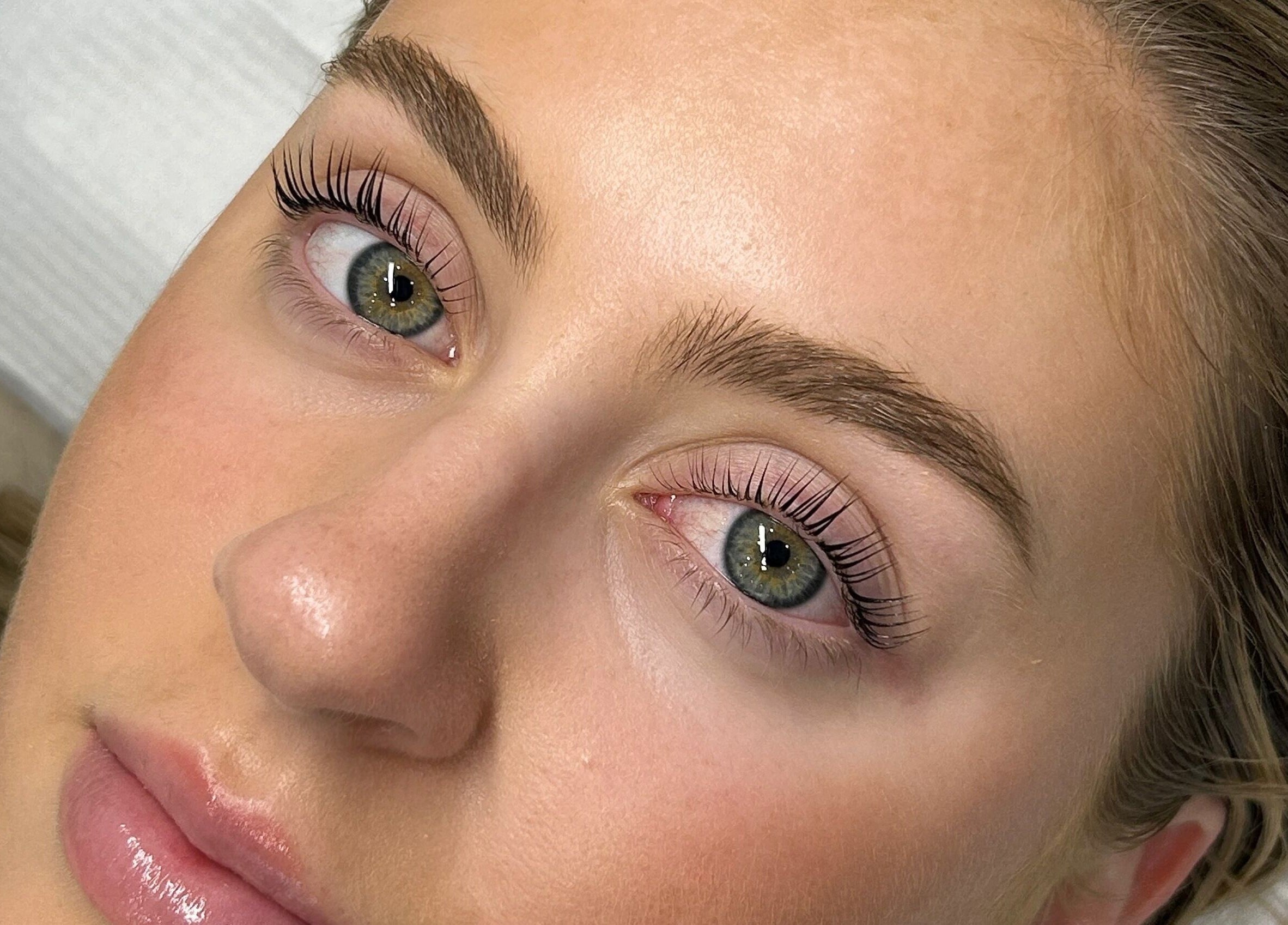 Close-up of a woman's enhanced lashes and brows at Charlotte J. Artistry, Brighton, South Australia, AU.