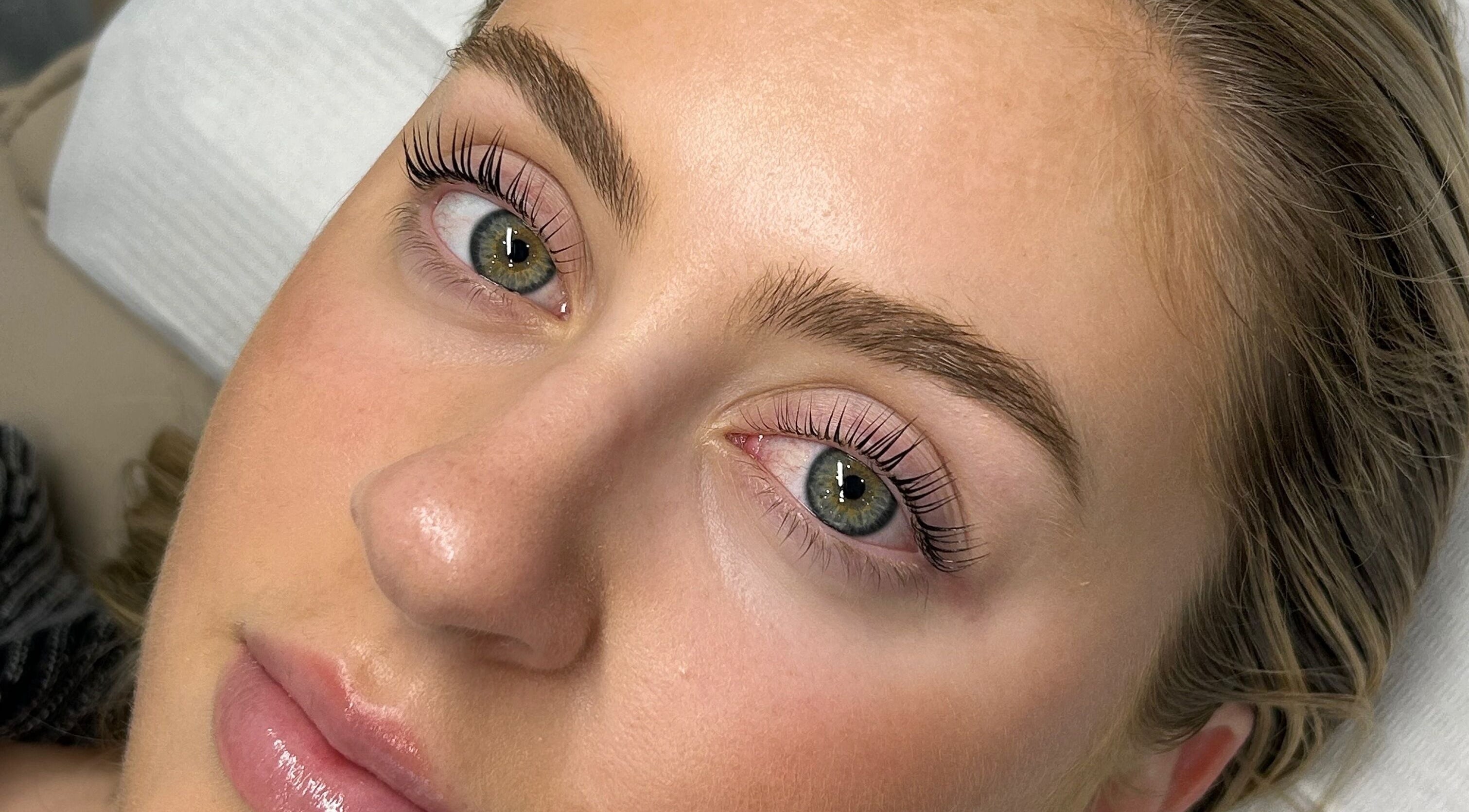Close-up of a woman's enhanced lashes and brows at Charlotte J. Artistry, Brighton, South Australia, AU.