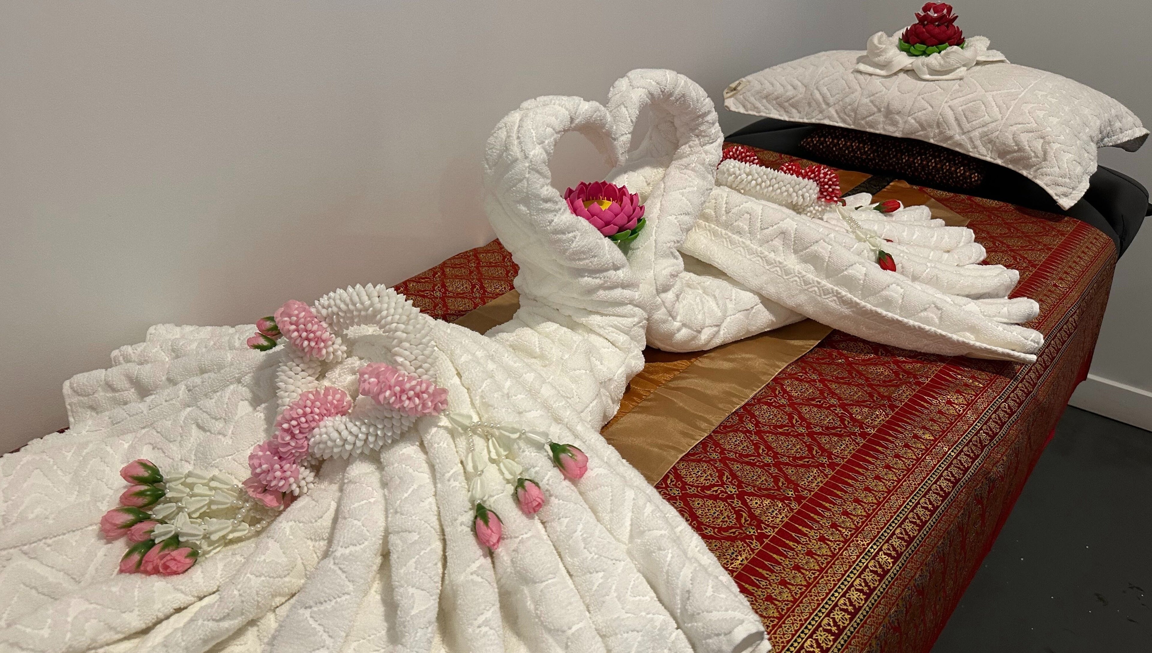 Beautifully arranged towels with floral accents at Na-ka Thai Day Spa, Woolloongabba, Queensland, AU.