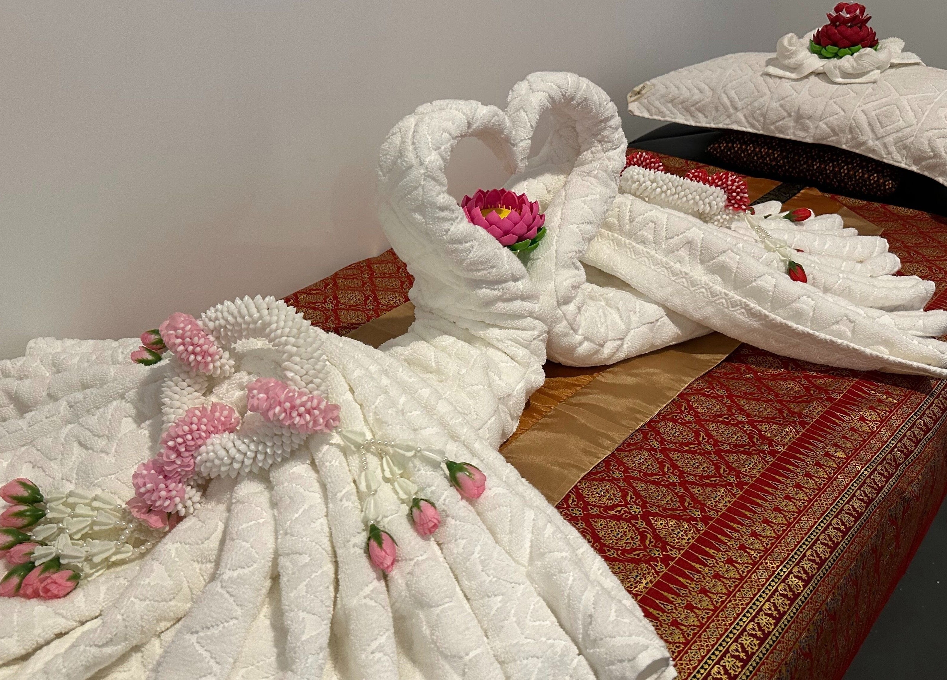 Beautifully arranged towels with floral accents at Na-ka Thai Day Spa, Woolloongabba, Queensland, AU.