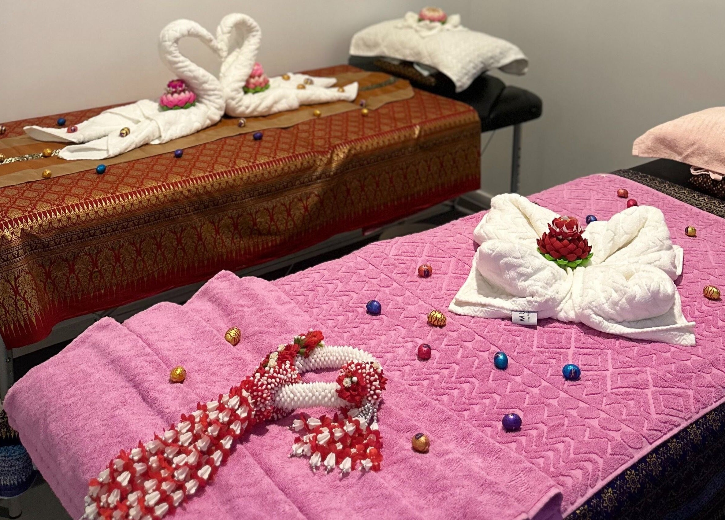 Luxurious massage tables with swan towels at Na-ka Thai Day Spa, Woolloongabba, Queensland, AU.