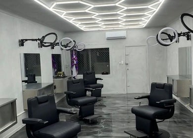 Interior of Studio Blendz in Southport, Queensland, AU, featuring modern salon chairs and geometric lighting.