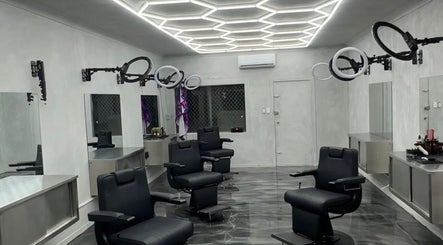 Interior of Studio Blendz in Southport, Queensland, AU, featuring modern salon chairs and geometric lighting.