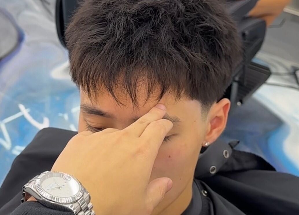 Haircut in progress at StudioBlendz Barbershop, Southport, Queensland, AU with focus on precise styling.