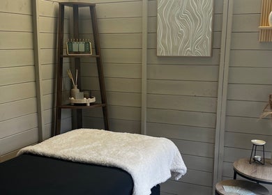 Relaxing spa room at Izzy’s Beauty Room, Gloucester, England, GB with a serene ambiance and stylish decor.