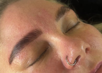 Close-up of calm client with expertly shaped brows at Izzy’s Beauty Room, Gloucester, England, GB.