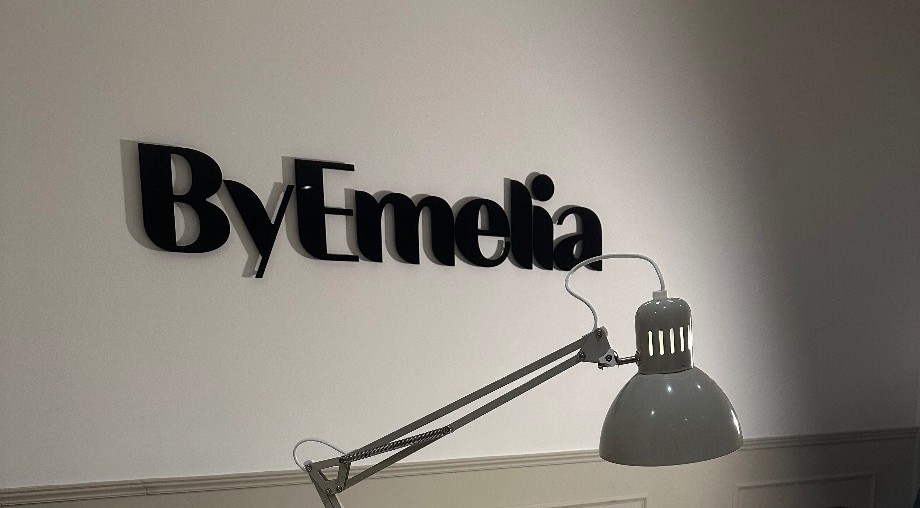 ByEmelia sign in Great Harwood, England, GB with a stylish lamp in foreground.