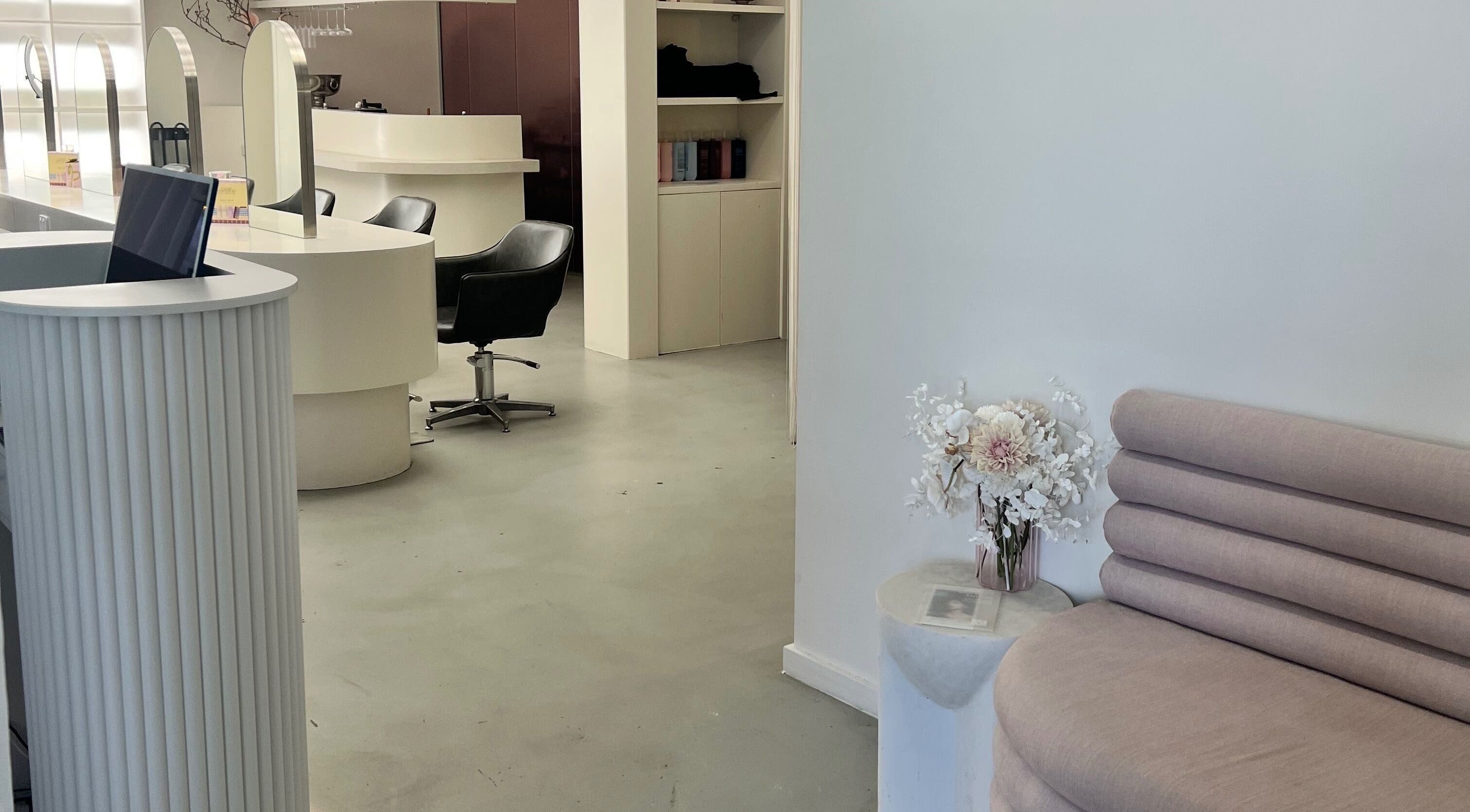 Chic, modern interior at Aesthetics By Kristen, Wollongong, New South Wales, AU, featuring elegant seating and decor.