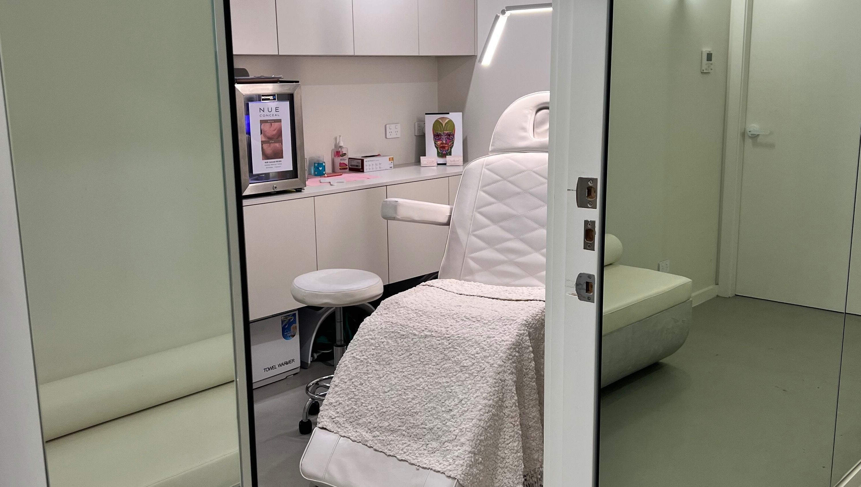 Elegant treatment room at Aesthetics By Kristen, Wollongong, New South Wales, AU with plush seating.