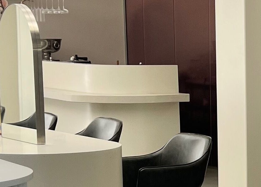 Modern chic salon interior with stylish seating at Aesthetics By Kristen, Wollongong, New South Wales, AU.