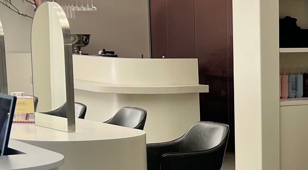 Modern chic salon interior with stylish seating at Aesthetics By Kristen, Wollongong, New South Wales, AU.