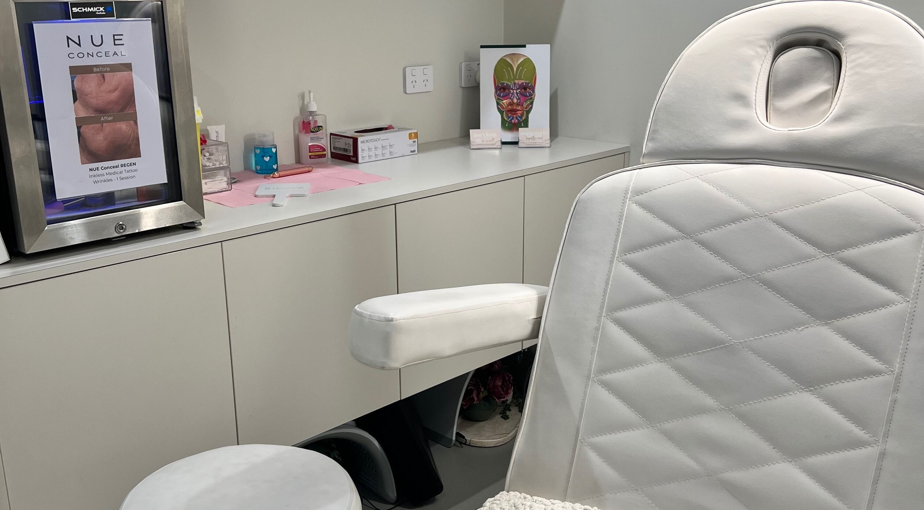Elegant treatment room at Aesthetics By Kristen, Wollongong, New South Wales, AU featuring a plush white chair.