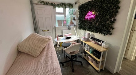 Modern beauty station at Holly Victoria Beauty in King's Sutton, England, GB, featuring a cozy setup with a nail polish display.