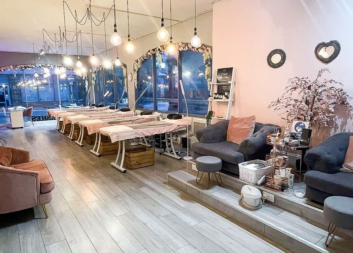 Elegant interior of Glambox, a serene beauty venue in Norwich, England, GB with plush seating and ambient lighting.