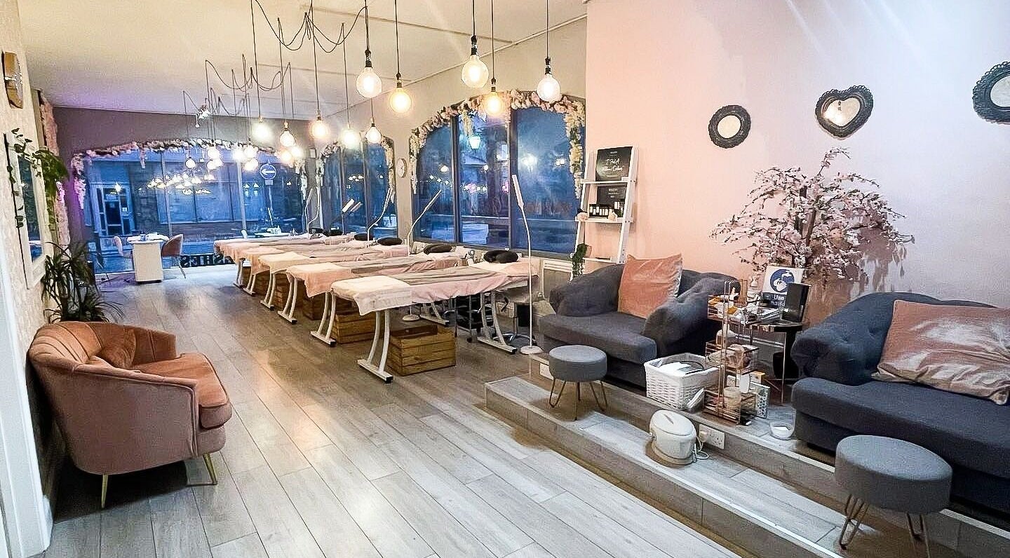 Elegant interior of Glambox, a serene beauty venue in Norwich, England, GB with plush seating and ambient lighting.