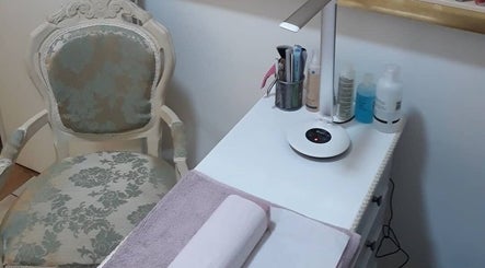 Elegant nail station at Pretty Nails Nottingham, Arnold, England, GB, featuring chic chair and manicure tools.