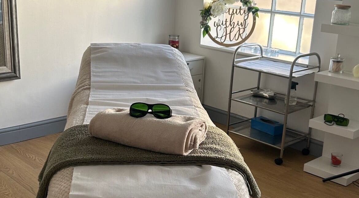 Relaxing treatment room at Tease 2, Hazel Grove, England, GB, featuring a cozy massage bed.