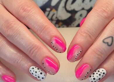 Vibrant pink and polka dot nail art at Nails with Love, Willenhall, England, GB.