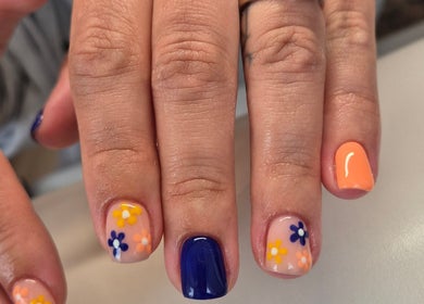 Vibrant floral nail art at Nails with Love, Willenhall, England, GB, showcasing intricate hand-painted designs.