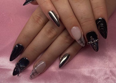 Elegant nail design at Esthers Glam On Wheels, Aberystwyth, Wales, GB on a soft pink backdrop.