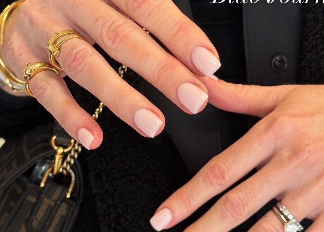 Elegant manicured hands at Fabulous Nails in Melbourne, Victoria, AU, showcasing stylish jewelry.