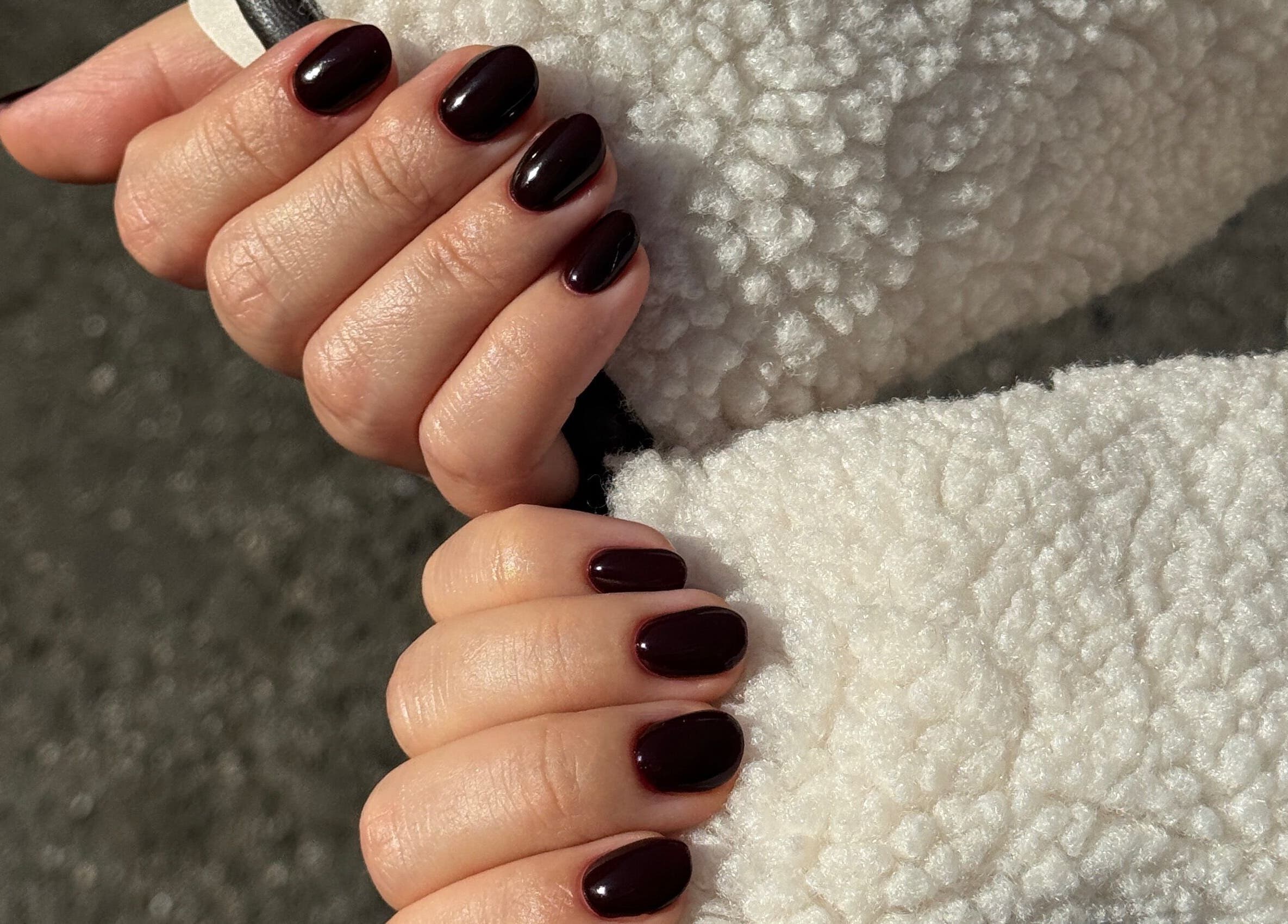 Elegant maroon manicure at Fabulous Nails, Melbourne, Victoria, AU, showcasing cozy winter style.