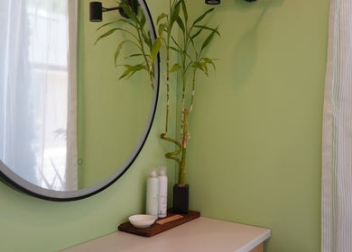 Elegant decor with bamboo and round mirror in Hada Studio, Christchurch, Canterbury, NZ.
